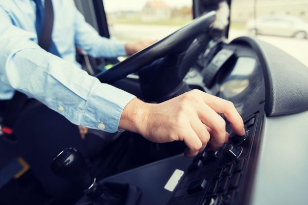 close up of driver driving passenger bus